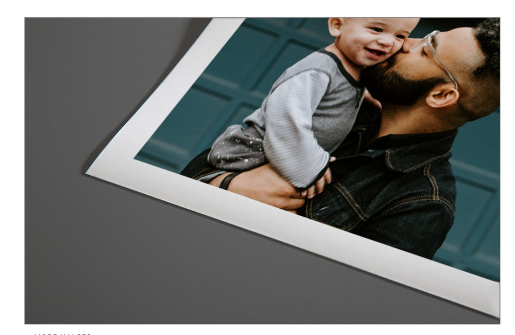 Man holding a child with a white border on a gray background