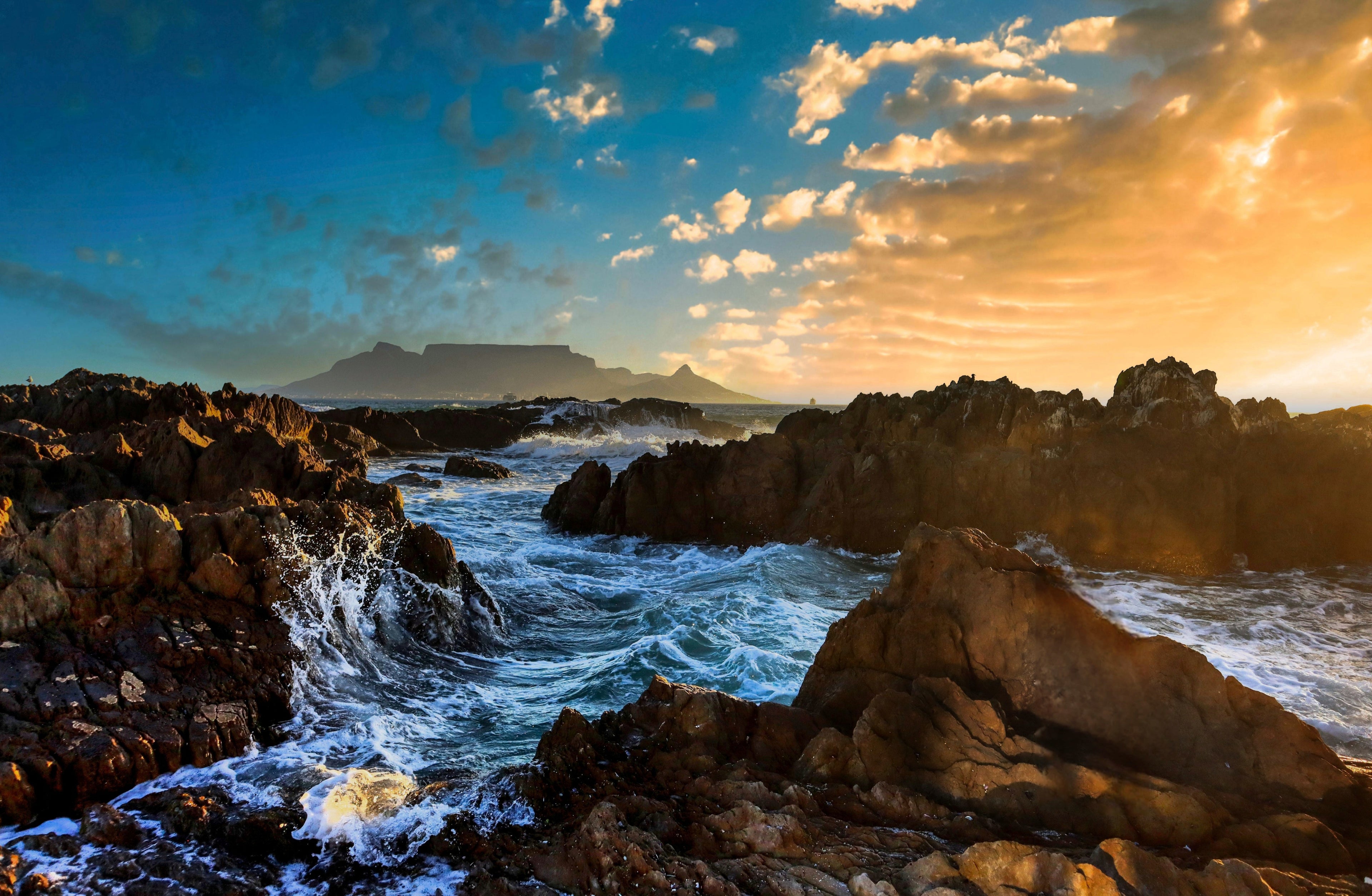 dramatic cape town ocean waves crashing rocks table mountain golden sunset seascape photography wall art print
